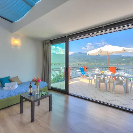 Red House: Beachfront Terrace & Private Beach - Happy Rentals Apartment Baveno