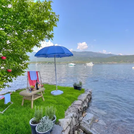 Red House: Beachfront Terrace & Private Beach - Happy Rentals Baveno